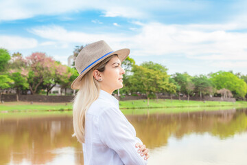 Agribusiness woman wearing hat and jeans at the end of a working day..