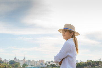 Agribusiness woman wearing hat and jeans at the end of a working day..