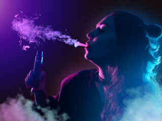 Woman with vape pen. Young girl with vape device on purple. Concept of selling vape gadgets. Woman...