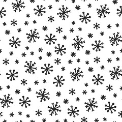Seamless pattern with black snowflakes on a white background in doodle style.