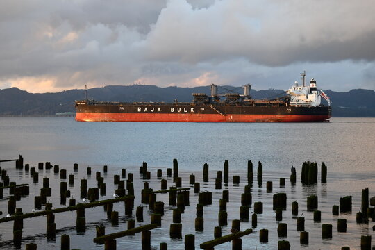 Large Cargo Freighter Cruising Up The Columbia River.