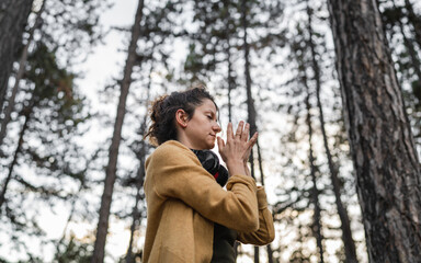 one woman in park or forest online guided meditation self-care concept
