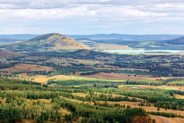 Fototapeta premium South Ural, Ural mountains in summer. Sunset in the mountains. The top of the mountain range. Summer day.