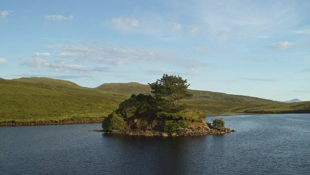 Flyover view of island in Loch Fada / Portree, Scotland