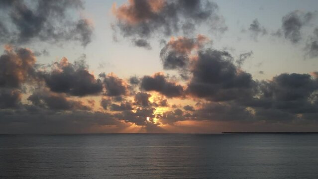Indian Ocean sunset near Uroa beach in Zanzibar Island, Tanzania Africa, Aerial pan left shot