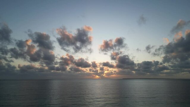 Sunset in the Indian Ocean at Uroa beach in Zanzibar Island, Tanzania Africa, Aerial flyover shot