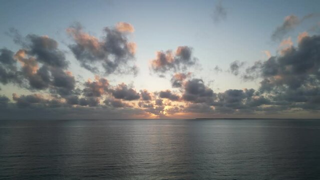 Indian Ocean sunset from Uroa beach in Zanzibar Island, Tanzania Africa, Aerial hovering shot