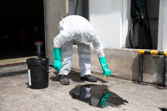 people cleaning chemical leak absorbent
