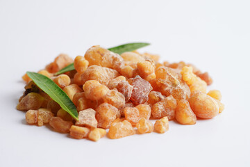 Frankincense or olibanum aromatic resin isolated on white background used in incense and perfumes.