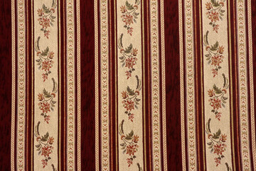 Fabric decorated with floral ornaments, seat cover in Turkey in red and white stripes.