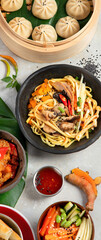 Assorted Chinese food on dark background. Asian food concept. Top view.