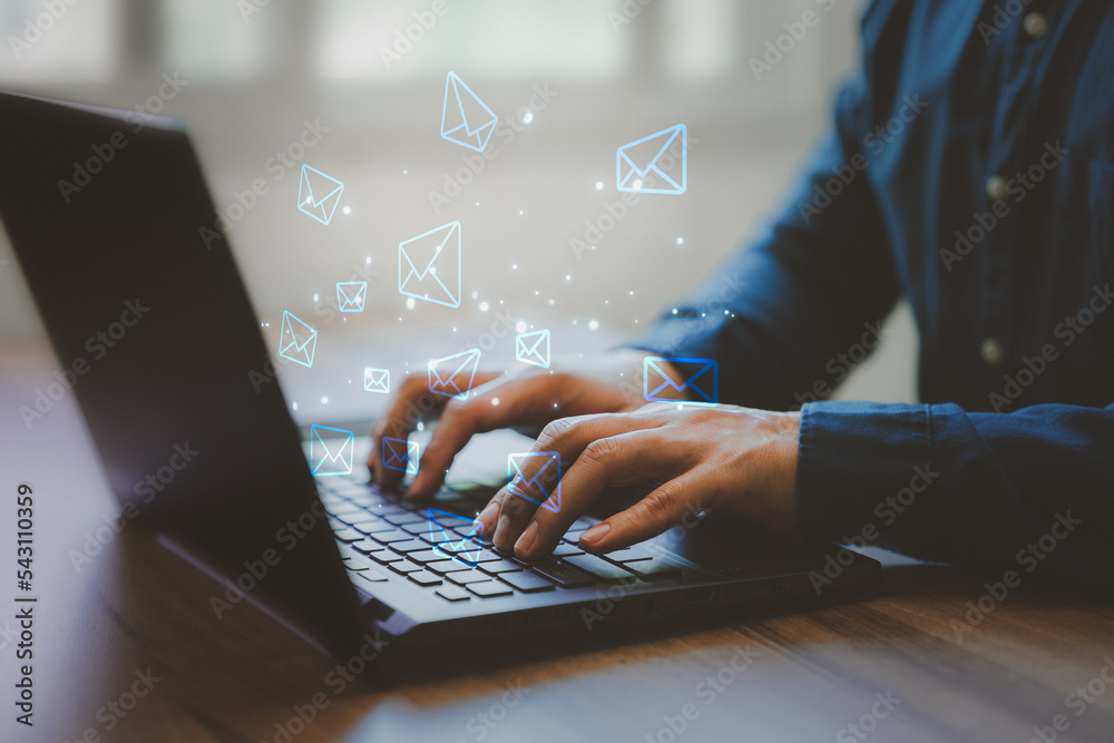 Poster Email Marketing and Newsletters, Technology and lifestyle concepts. Man's hand using computer laptop and sending online message with email icon.