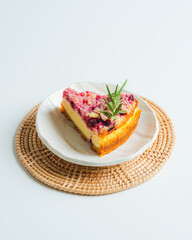 Raspberry cheez cake pie on white plate on white teble background. 