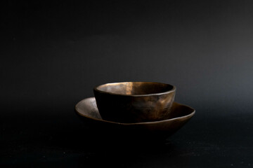 Empty Copper Glazed Ceramic Tea cup and saucer