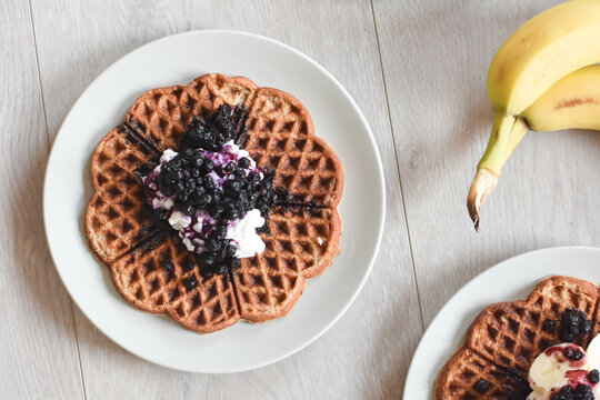 Delicious dessert waffles with blueberry, cottage cheese and banana