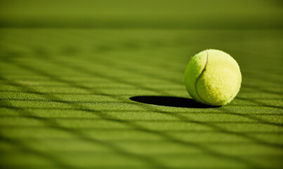 Tennis, sport and fitness with tennis ball on turf with green closeup and texture, sports match and...