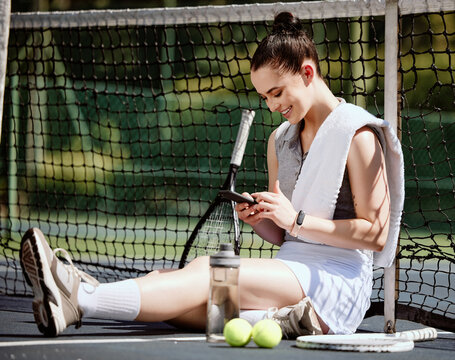 Relax, fit and phone with woman tennis player browsing, social media or web outdoor on the court. A happy young female athlete or sportswoman posting her sport training online or on the internet