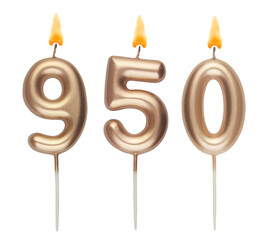 Burning golden birthday candles isolated on white, number 950	