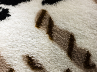 Fabric texture with white and brown hairs with micropores. macro