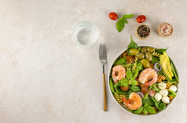 Pasta or noodle salad from wheat and lentils fusilli with avocado and shrimp. Lunch or dinner meals...