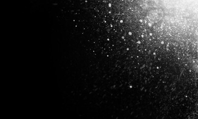 Abstract particle dust powder on black background