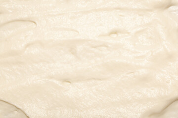 Cream texture for face and body skin care. White lotion, moisturizer, skin care cosmetics application background.