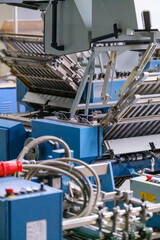 Industrial folding machine in typography workshop