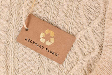 Knitted fabric with label saying 'recycled fabric'