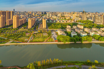 Fototapeta premium Overlooking the skyline and canal bridge of modern urban architecture in Jiangyin, China 