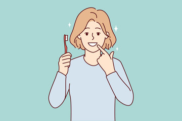 Smiling girl with toothbrush show at white clean teeth. Happy child recommend teeth brushing and oral care. Dental care concept. Vector illustration. 