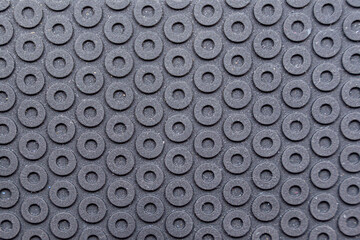 Seamless black studded rubber floor panels for texture or background. High quality photo