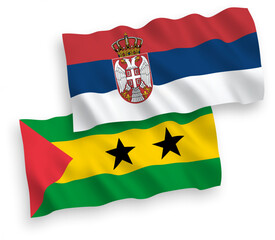 National vector fabric wave flags of Saint Thomas and Prince and Serbia isolated on white background. 1 to 2 proportion.
