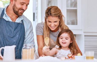 Cooking, family and bakery food in kitchen with child learning, helping and happy with smile. Family home, mother and dad teaching young kid baking flour recipe for cake, cookies or pancakes.