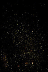 blurry sparks from fireworks on black background