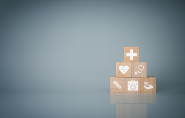 Obraz premium Wooden cube blocks stacked with icons. Health and Medicine Concepts.