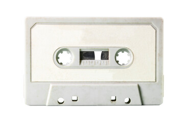 An isolated old vintage cassette tape from the 1980s (obsolete music technology). Dirty white...