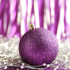 Purple glittery bauble christmas tree decoration with pink and silver ribbons, string and tinsel