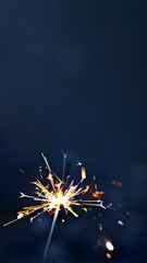 burning sparkler on blue background, the concept of the holiday, vertical, 16:9