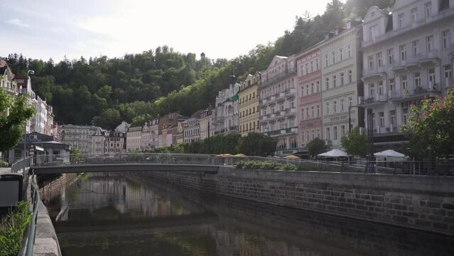Karlovy Vary or Carlsbad, bridge over Tepla river, main passage panning view, Czech Republic