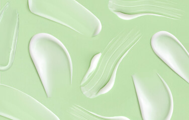 pattern cosmetic smears cream texture on pastel green background