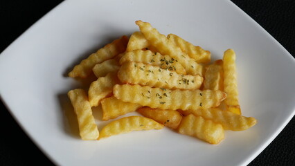 Close up of frenchfries on the white plate