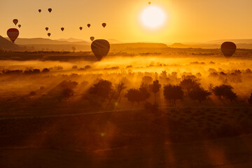 Balloons at dusk in Cappadocia. Famous flight in Goreme. Turkey