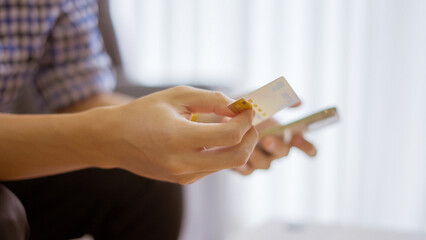 Men holding credit card and Shopping on smart phone at home