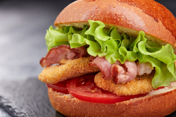 tasty burger with beef cutlet and vegetables