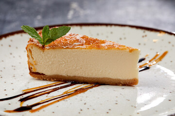 tasty cheesecake with chocolate sauce