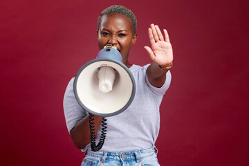 Black woman, protest and shouting with megaphone for voice, strike or stop against a studio...