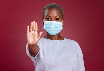 Covid, stop and healthcare with hands of black woman for safety, healthcare and global pandemic. Warning, caution and risk sign with portrait of girl for attention to virus, danger and sick