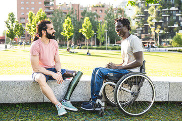 Two friends with disability having break time in a city park