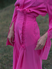 Beautiful elegant woman in pink suit, fashion, lookbook