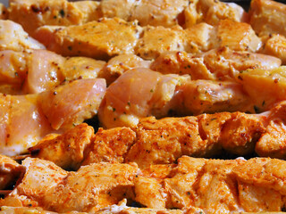 Meat skewers being grilled in a barbecue